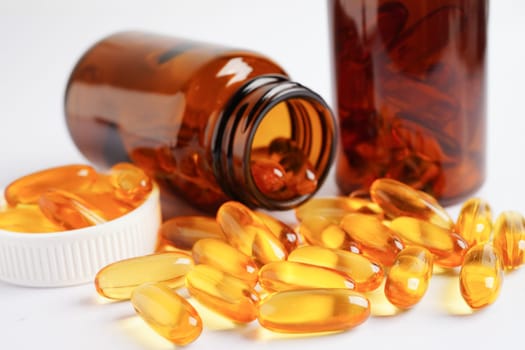 Fish oil or Cod liver oil gel in capsules with omega 3 vitamins, supplementary healthy food 