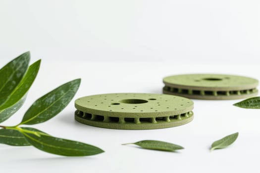 Eco-conscious brake pads showcased on a simple white surface, emphasizing sustainable materials and green design. the image includes natural green elements, the environmentally friendly approach and innovative design.