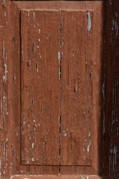 An aged wooden panel, showing intricate textures and layers, captures the essence of rustic charm and history.