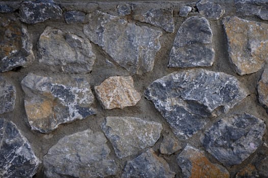 A close-up view reveals the intricate arrangement of natural stones, showcasing various textures and hues.