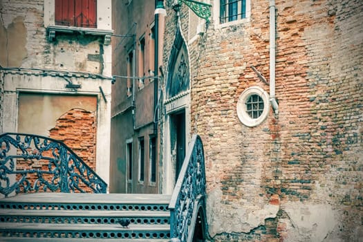 Ponte  La Malvasia Vechia in Venice. Italy. Edited as a vintage photo.