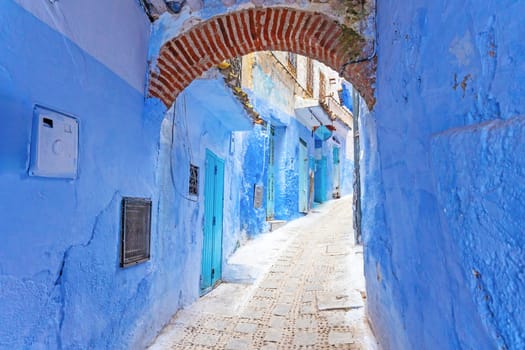 Blue archway in a empty  street in the city of Chefchaouen.  Morocco.  Horizontally. Morocco. 