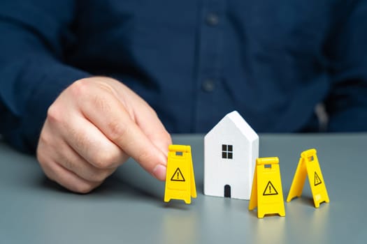 A man installs restriction signs around the house. Asset freezing. Property seizure. Foreclosure for debts and non-payment of mortgages. Emergency housing requiring repair. Building contamination.