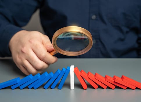 A man studies the opposition of the parties. The concept of a draw. Stop the conflict. Prevent escalation. Find points of compromise. A basis for starting negotiations.