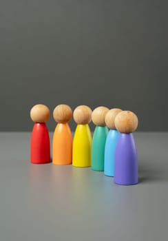 Figures of people lined up in the colors of the LGBT flag. Lesbian, gay, bisexual, and transgender. International Pride Day. Protection of the rights and freedoms of sexual minorities.