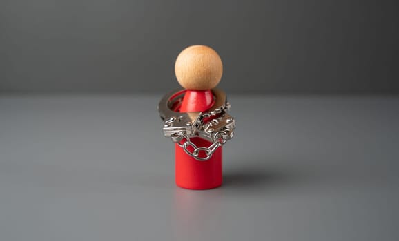 A man handcuffed to himself. The concept of complexes and stiffness. Shyness. High risk of mental breakdown. Depression and frustration. Censure, psychological abuse. Get outside the box.