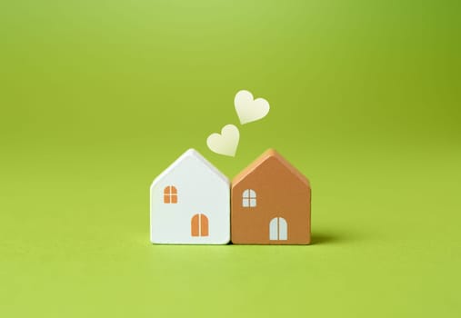 Two houses and hearts. Love and relationships concept. Purchase joint real estate.