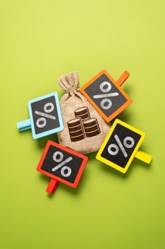 High debts and deductions. High tax burden. Money bag and a lot of interest attached. The highest interest rate on the deposit. Personal finance, taxation policy, and investment strategies.