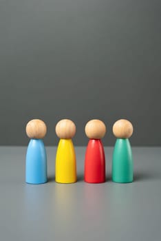 Multi-colored people figures. People representing different groups, communities and cultures. Consumer groups, their preferences and purchasing power. Marketing and segmentation.