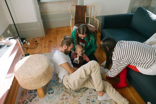 A heartwarming scene showcases genuine family interaction and playful moments in a stylishly designed living room