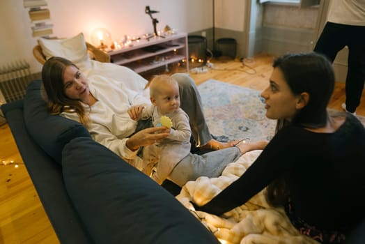 A heartwarming scene where a loving family is joyfully interacting playfully with their adorable baby