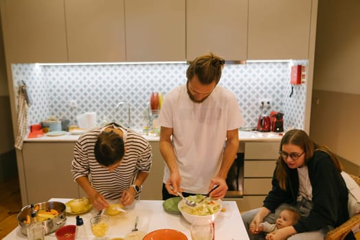 A joyful family happily engaging in fun cooking activities in a stylish, modern, and contemporary kitchen setting