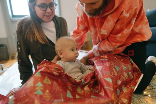 A heartwarming scene of a family joyfully celebrating the holidays with their baby in festive decorations