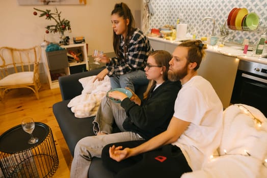 Friends share a warm, joyful moment in a stylish living room, enjoying delightful company and meaningful conversation