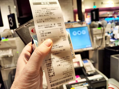 Osaka, Japan - October 26, 2024: Receipt shows a list of products purchased at a convenience store in Osaka, highlighting the local shopping experience and pricing.