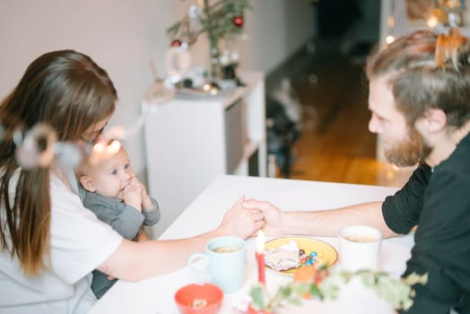 A heartwarming family moment with a baby at the dining table, joyfully enjoying coffee and connection