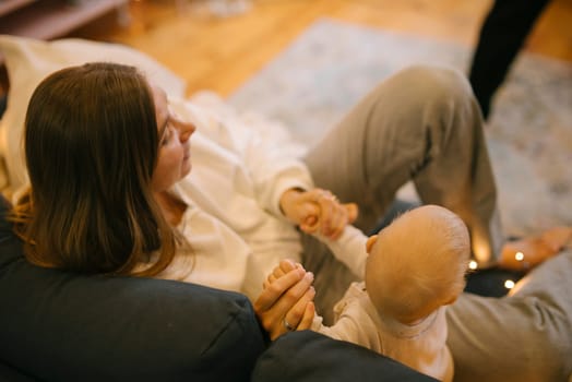 A heartwarming scene of a loving mother sharing precious moments of bonding with her baby in a cozy home setting