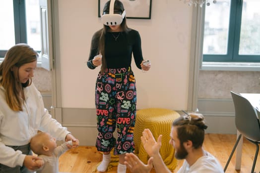 A family happily enjoys a delightful and exciting virtual reality experience together in a cozy home setting