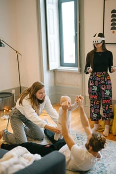 A lively group of friends enjoys an exciting and funfilled VR gaming session in their cozy living room space