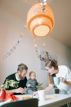 A delightful family moment at the dining table, showcasing love and connection in a bright, inviting space