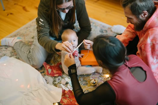 A happy and joyful family interaction with a baby, wonderfully creating festive memories together as one
