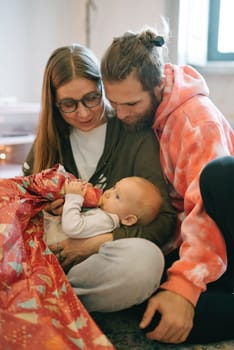 A heartfelt family moment of caring for a baby, showcasing deep love and emotional connection that warms the heart