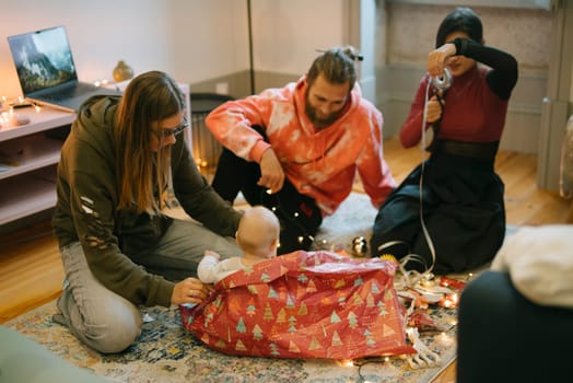 A joyful family happily gathers together to warmly celebrate the holidays, wrapping gifts with love and great care
