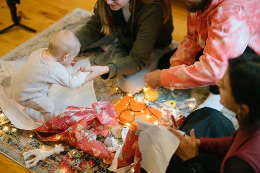 A heartwarming scene of family joy during holidays, with colorful decorations and gift wrapping, creating memories