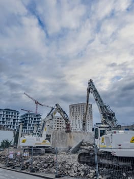 France, Bordeaux 01.20.2025, Building demolition excavator with mechanical arm. Destruction of houses. Heavy machinery, hydraulic construction equipment. High quality photo