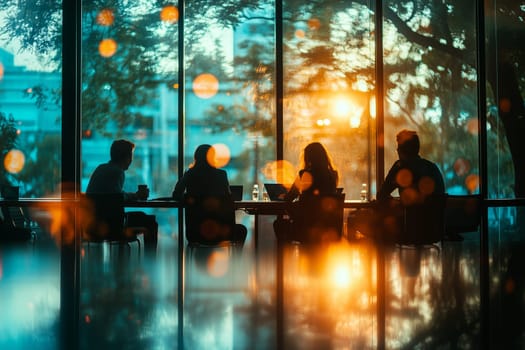 Silhouetted team collaborating in modern office setting