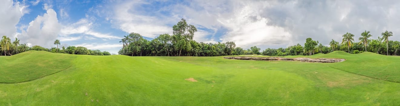 Scenic panorama of a tropical golf course surrounded by lush jungle. Serene landscape ideal for relaxation, sports, and luxury travel. Nature, recreation, and tropical getaway concept.