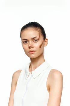 A stunning portrait of a model featuring unique artistic makeup emphasizing diversity and beauty against a minimalist light backdrop, perfect for fashion content.