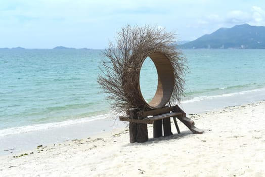 Wooden photozone on Vietnamese sandy beach