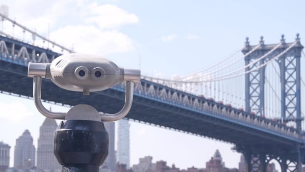 New York City, United States - 30 Aug 2023: Manhattan Bridge lookout, tower viewer binoculars, Brooklyn telescope viewpoint, Dumbo tourist landmark. East River John street park promenade. Travel USA.