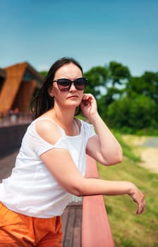 portrait of 36 years old russian woman in sunglasses on the summer day