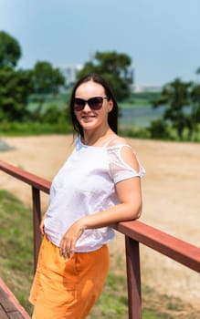 portrait of 36 years old russian woman in sunglasses on the summer day