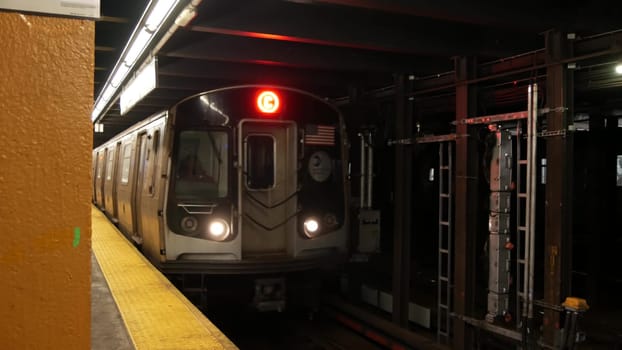 New York City, United States - 30 Aug 2023: Subway station interior, underground metropolitan platform. Metro railway passenger public transport. Manhattan railroad transportation, NYC traffic. People
