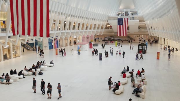 New York City, United States - 10 Sept 2023: World Trade Center Oculus transport hub architecture. Manhattan Downtown Financial District, USA urban life. People. September 11 remembrance american flag