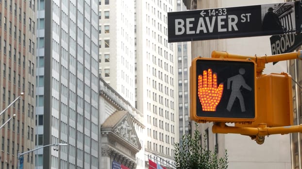 New York City, United States - 9 Sept 2023: Manhattan Downtown Financial District. American flag, Wall street. Broad and Beaver corner road sign. Stock Exchange building, USA Stock Market. Crossroad.