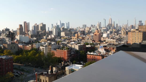 New York City, United States - 7 Sept 2023: Manhattan skyline cityscape. Empire State Building, Hudson Yards. Rooftop, residential house roof. Urban street architecture. Midtown district, East Village