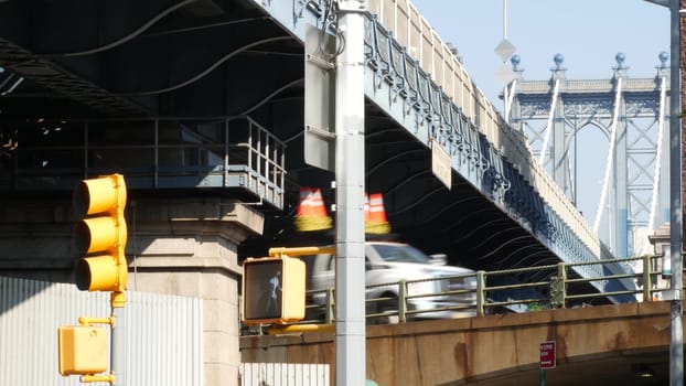 New York City, United States - 7 Sept 2023: Traffic road under Manhattan Bridge in Brooklyn. Cars on street, transport intersection in Dumbo. Vehicles below bridge on Brooklyn - Queens expressway.