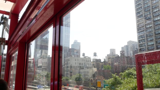 New York City, United States - 4 Sept 2023: Roosevelt Island tramway to Manhattan Midtown streets. American cable tram, Queensboro Bridge. Urban public transport, USA. Building architecture cityscape.