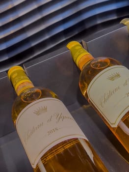 Two bottles of 2018 Sauternes wine are elegantly presented, highlighting the rich color and luxurious design that signifies a high-quality vintage selection.