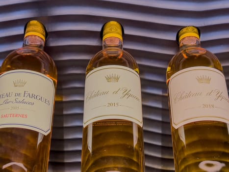 Two bottles of 2018 Sauternes wine are elegantly presented, highlighting the rich color and luxurious design that signifies a high-quality vintage selection.