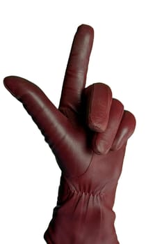 Hand in a burgundy leather glove pointing upward with a finger gesture, isolated on a white background. Ideal for fashion advertising, accessory promotions, creative designs, and symbolic concepts