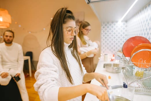 A cozy and warm indoor environment highlighting joyful family interactions while cooking and caring for a baby together