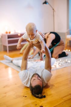 A truly joyful moment of a loving parent engaging in play with a delightful baby, showcasing love and family bonding