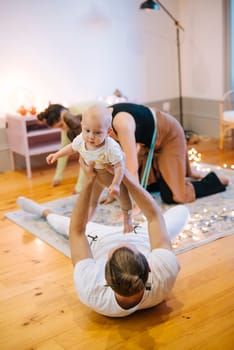 A delightful and joyful scene depicting family bonding through playtime, filled with love, laughter, and a baby
