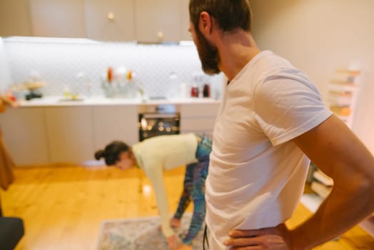 A delightful couple enjoys quality time together in a beautifully styled, modern, and inviting kitchen space