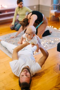 Experience a joyful moment of family connection featuring stretching and engaging playful interactions that unify